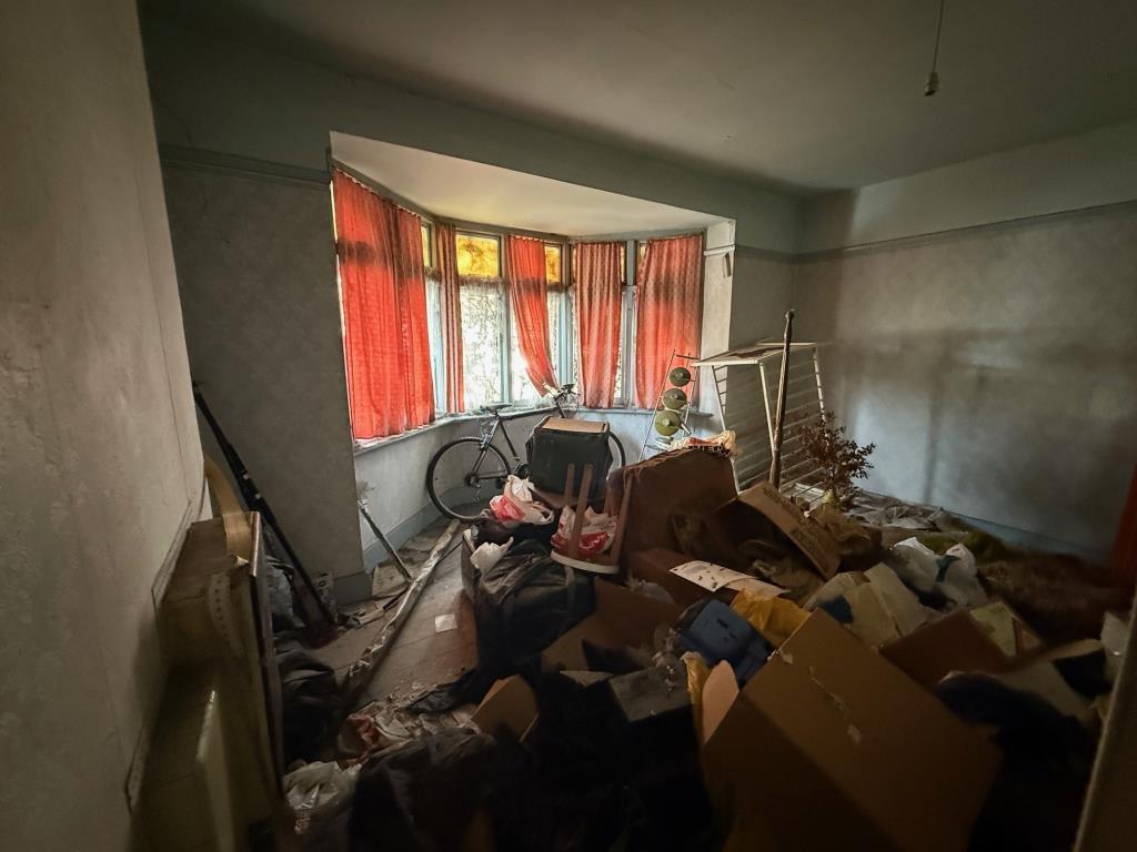 Lot: 170 - HOUSE FOR COMPLETE REFURBISHMENT - Front bedroom with possessions